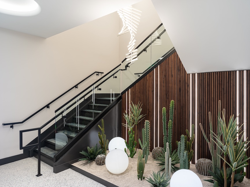 Staircase in Apollo Apartments.  Terrazo Floor by Corradini Corp.  Interior Design by Nadia Geller Designs